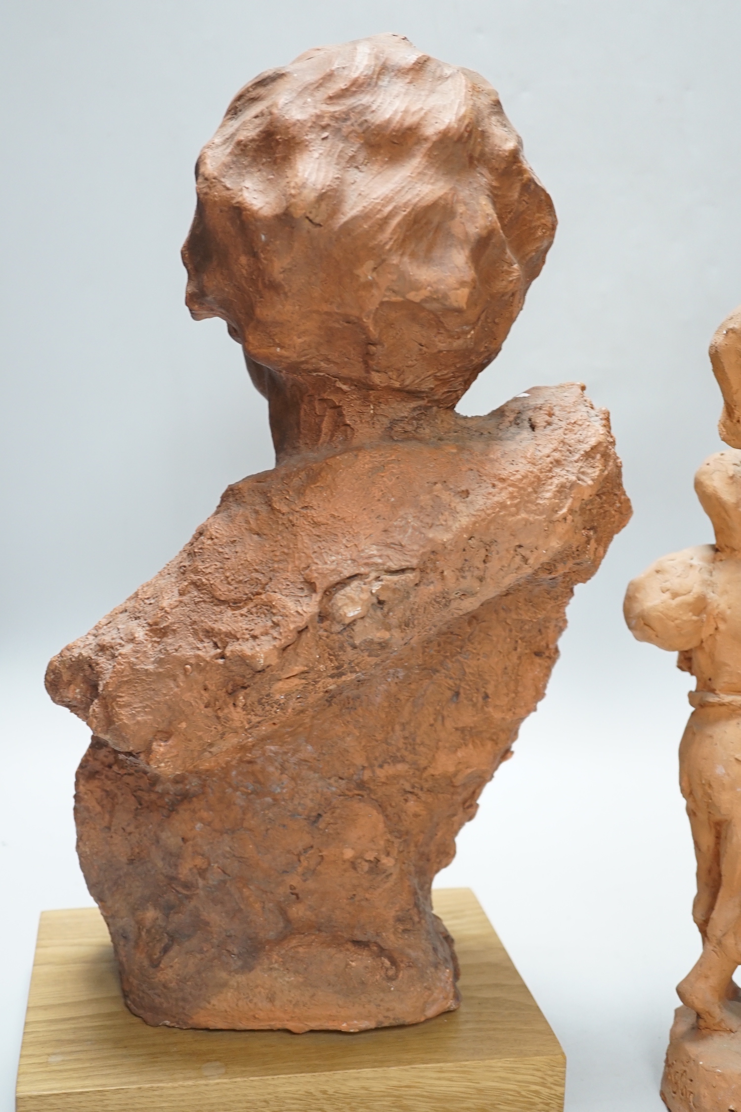Marcus Cornish (1964-) - ‘’Refugee’’, a terracotta sculpture and one other terracotta sculpture of a mother and child, indistinctly signed, the largest 46cm high (2)